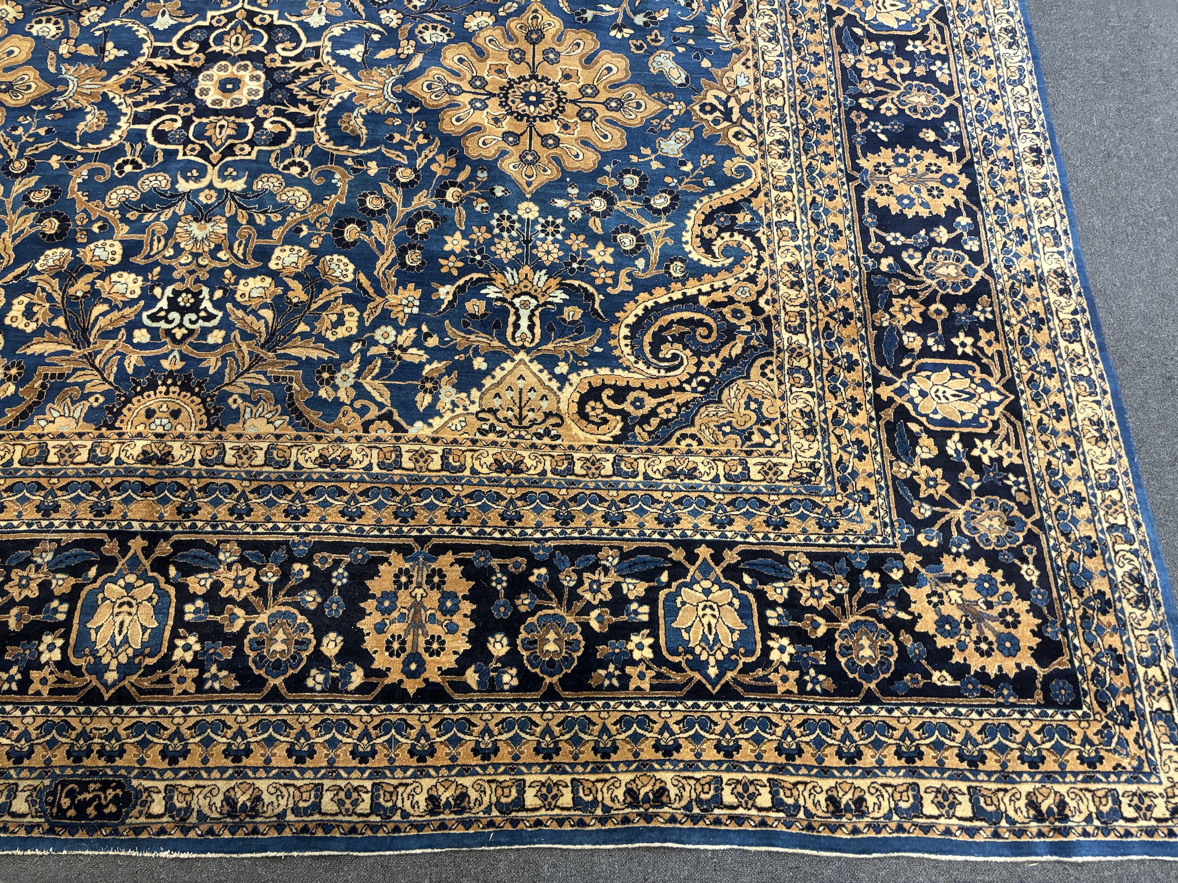 An early 20th century Kirman blue ground carpet, 425 x 325cm